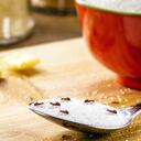 small red ants on a spoon with sugar, pest problems indoors