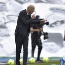 Real Madrid's head coach Zinedine Zidane talks to Real Madrid's Casemiro during the Spanish La Liga last round soccer match between Real Madrid and Villarreal at the Alfredo Di Stefano stadium in Madrid, Saturday, May 22, 2021. (AP Photo/Pablo Morano)