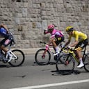 Switzerland's Silvan Dillier, Switzerland's Stefan Bissegger, and Slovenia's Tadej Pogacar, wearing the overall leader's yellow jersey, from left, ride during the ninth stage of the Tour de France cycling race over 193 kilometers (119.9 miles) with start in Aigle, Switzerland and finish in Chatel les Portes du Soleil, France, Sunday, July 10, 2022. (AP/Thibault Camus)