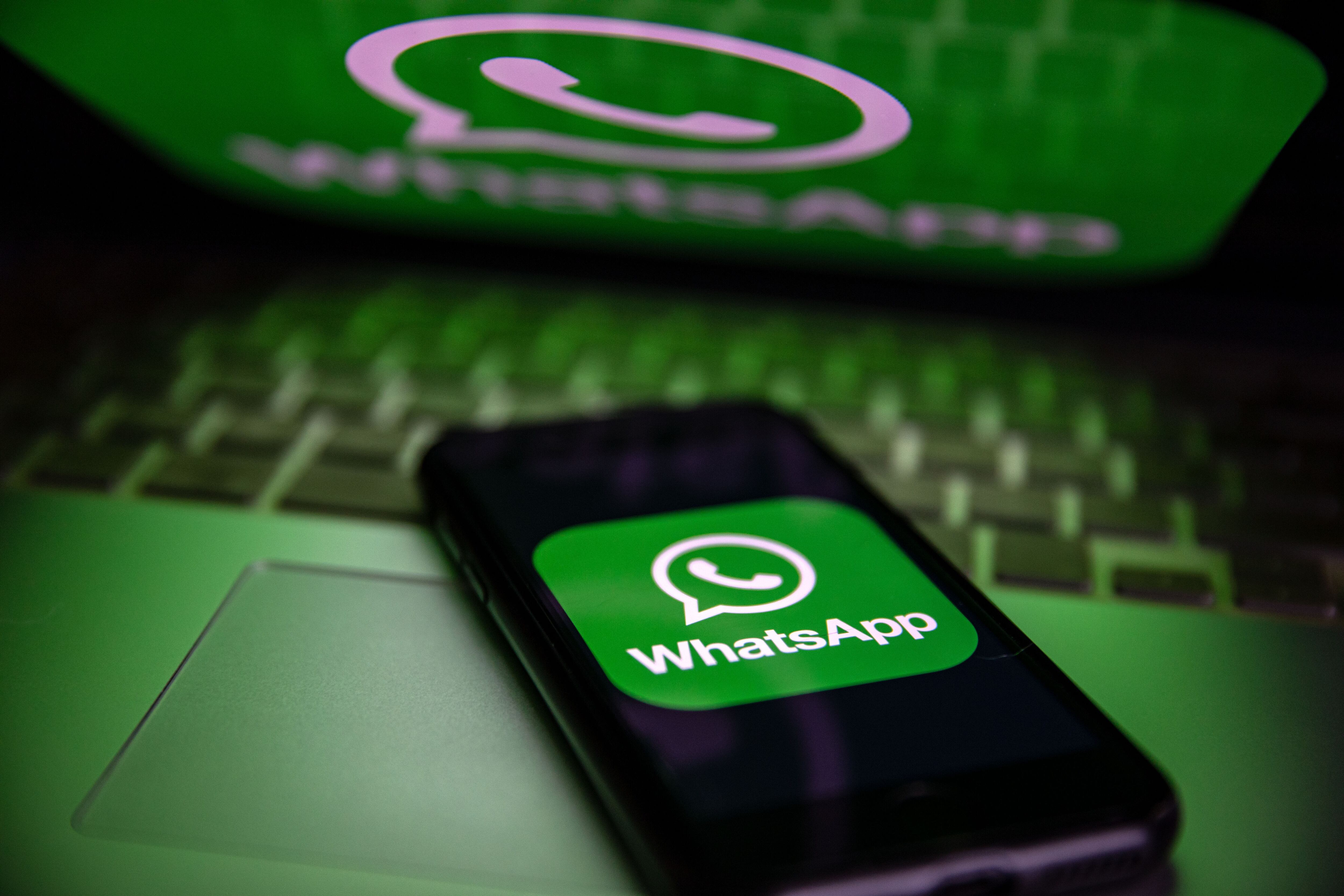 TURKEY - 2022/10/25: In this photo illustration, a WhatsApp logo seen displayed on a smartphone screen and on a laptop. (Photo Illustration by Onur Dogman/SOPA Images/LightRocket via Getty Images)