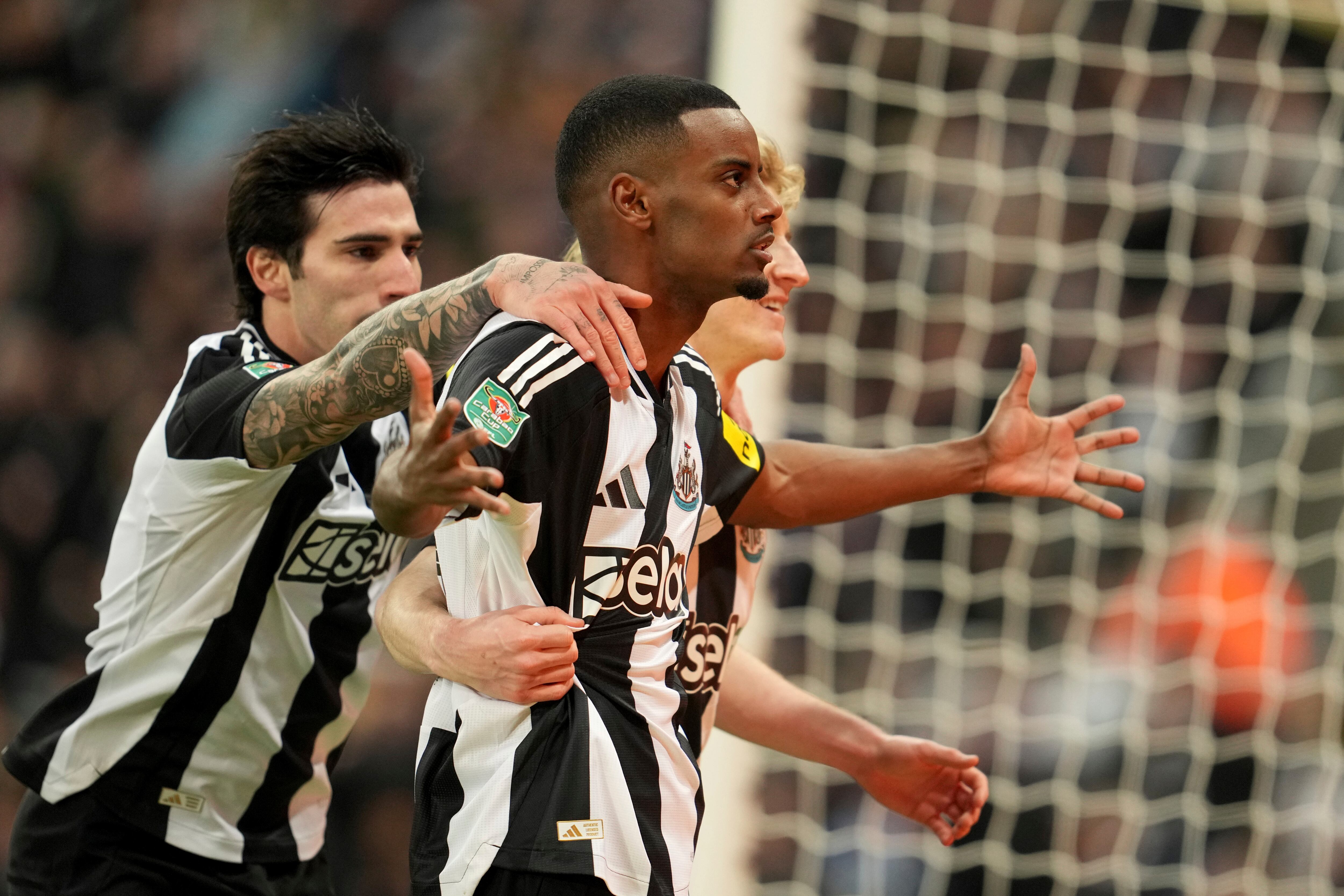 Newcastle's Alexander Isak celebrates with teammates after scoring his side's first goal during the English League Cup soccer match between Newcastle United and Arsenal at St. James' Park stadium in Newcastle, England, Wednesday, Feb. 5, 2025. The goal later was disallowed. (AP Photo/Jon Super)