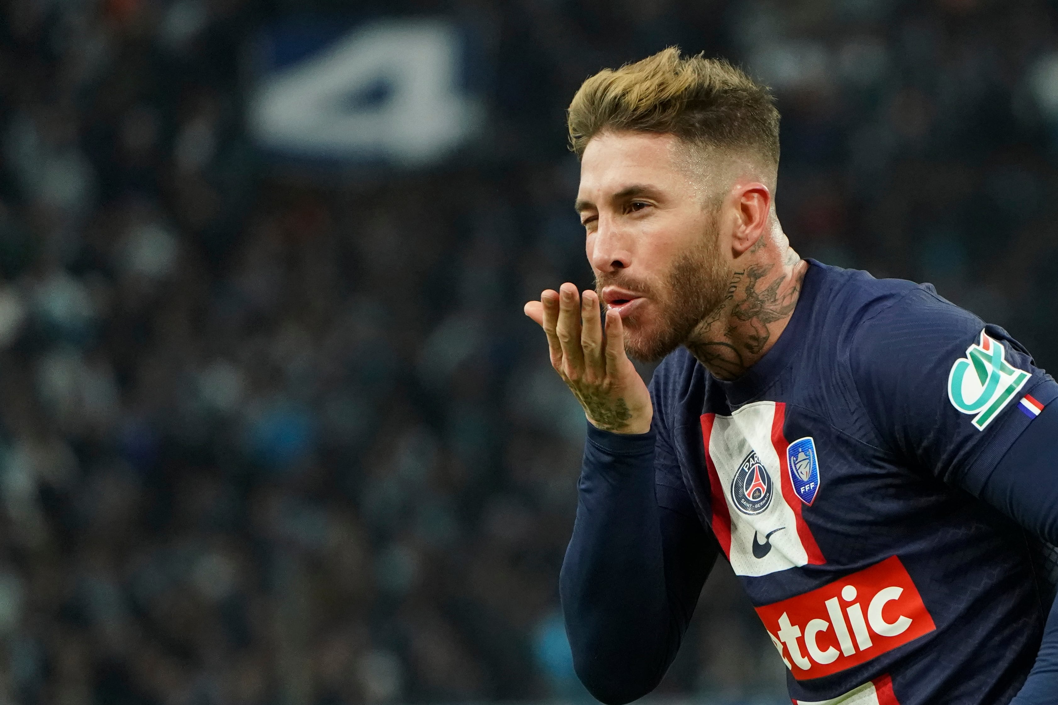 PSG's Sergio Ramos celebrates after scoring his side's opening goal during the French Cup soccer match between Olympique de Marseille and Paris Saint Germain at the Velodrome stadium in Marseille, southern France, Wednesday, Feb. 8, 2023. (AP Photo/Laurent Cipriani)