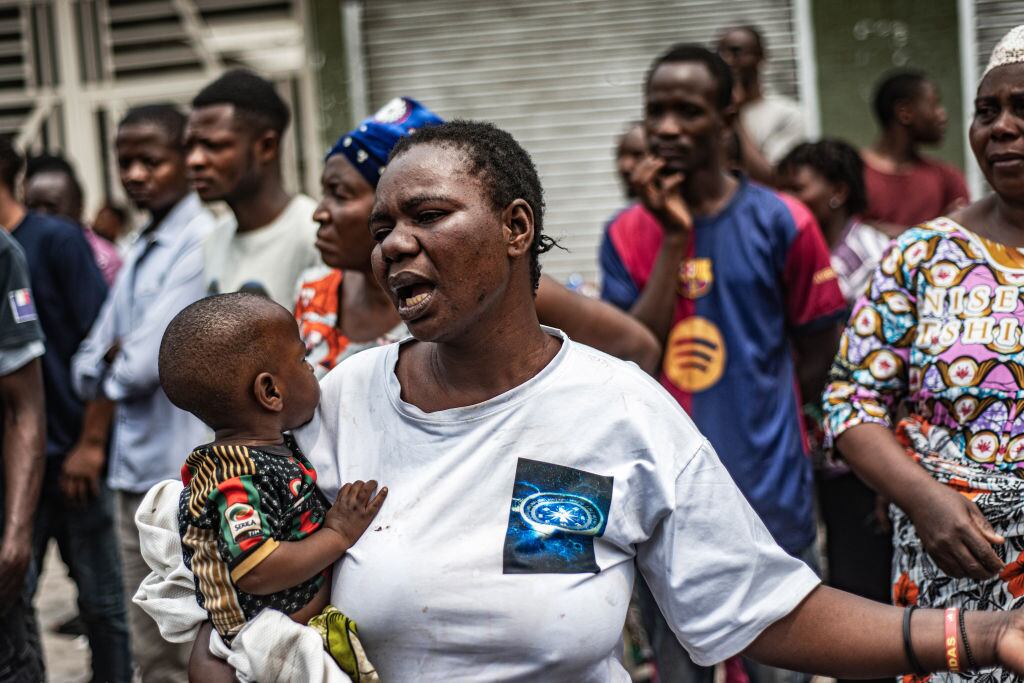GOMA, DEMOCRATIC REPUBLIC OF CONGO - JANUARY 30: The wife of a detained FARDC soldier decries her husband's detention as FARDC soldiers are loaded onto trucks, to be taken to an unknown location, as an estimated 2400 Congolese (FARDC) soldiers surrendered en masse to M23 forces at the Stade de l'Unite on January 30, 2025 in Goma, Democratic Republic of Congo.  The Rwanda-backed M23 rebel group has seized control Goma, in Eastern Congo, and are reportedly advancing south. (Photo by Daniel Buuma/Getty Images)