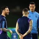 DOHA, QATAR - NOVEMBER 25: Lionel Messi of Argentina reacts with Lionel Scaloni, Head Coach of Argentina, during the Argentina MD-1 training session at Qatar University on November 25, 2022 in Doha, Qatar. (Photo by Robert Cianflone/Getty Images)