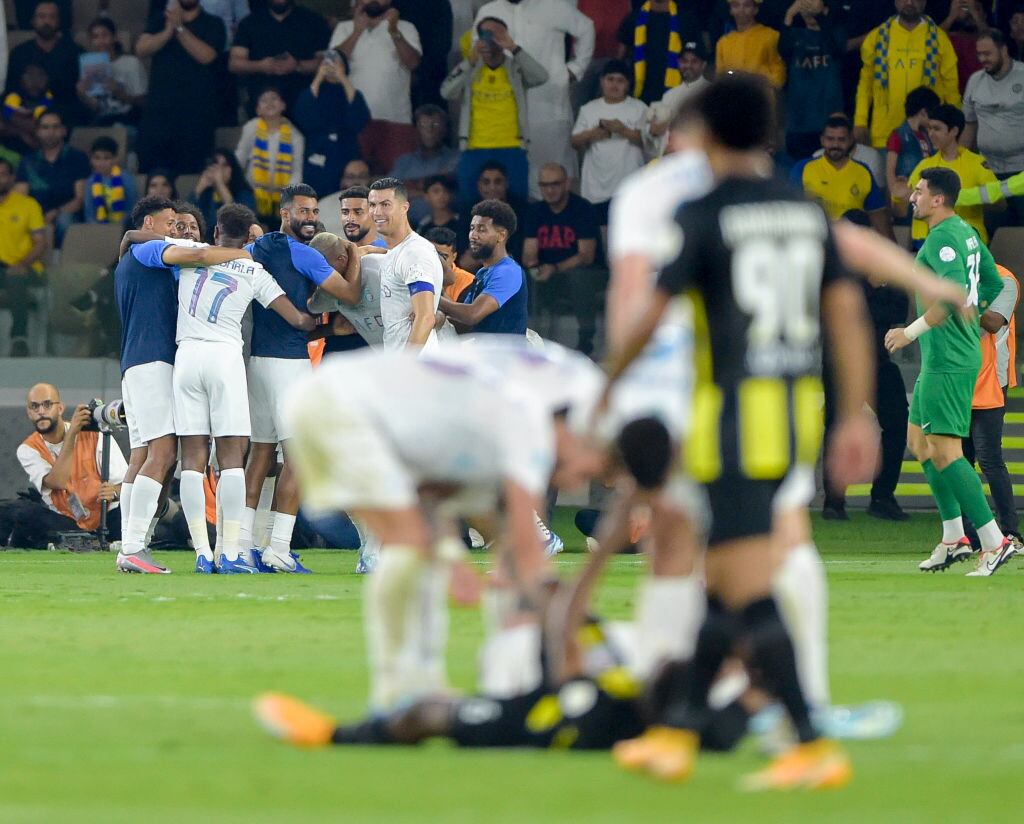 JEDDAH, SAUDI ARABIA - DECEMBER 26: The Al Nassr players celebrate a goal during the Saudi Pro League match between Al-Ittihad and Al-Nassr at Prince Abdullah Al Faisal Stadium on December 26, 2023 in Jeddah, Saudi Arabia. (Photo by Khalid Alhaj/MB Media/Getty Images)