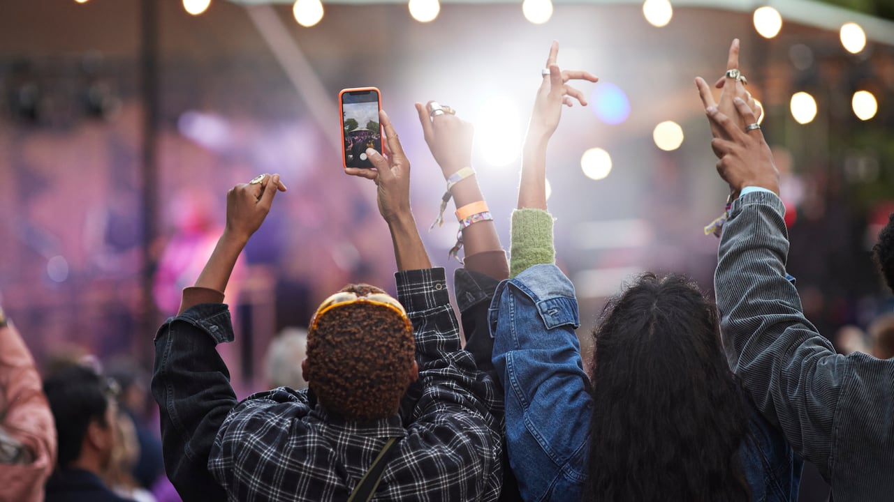 Friends hanging out at big music festival