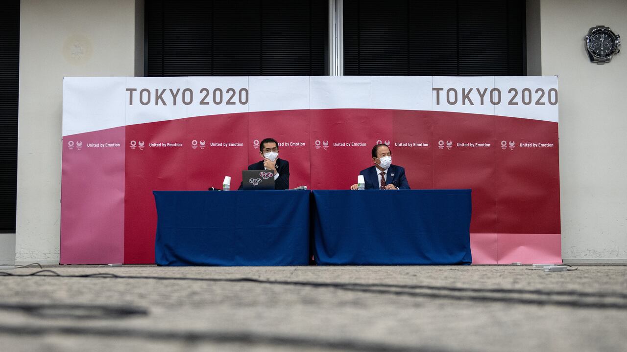 Tokyo 2020 Olympic Games CEO Toshiro Muto (R) speaks during a press conference following a Tokyo 2020 Olympics Executive Board meeting in Tokyo on December 22, 2020. (Photo by Carl Court / POOL / AFP)