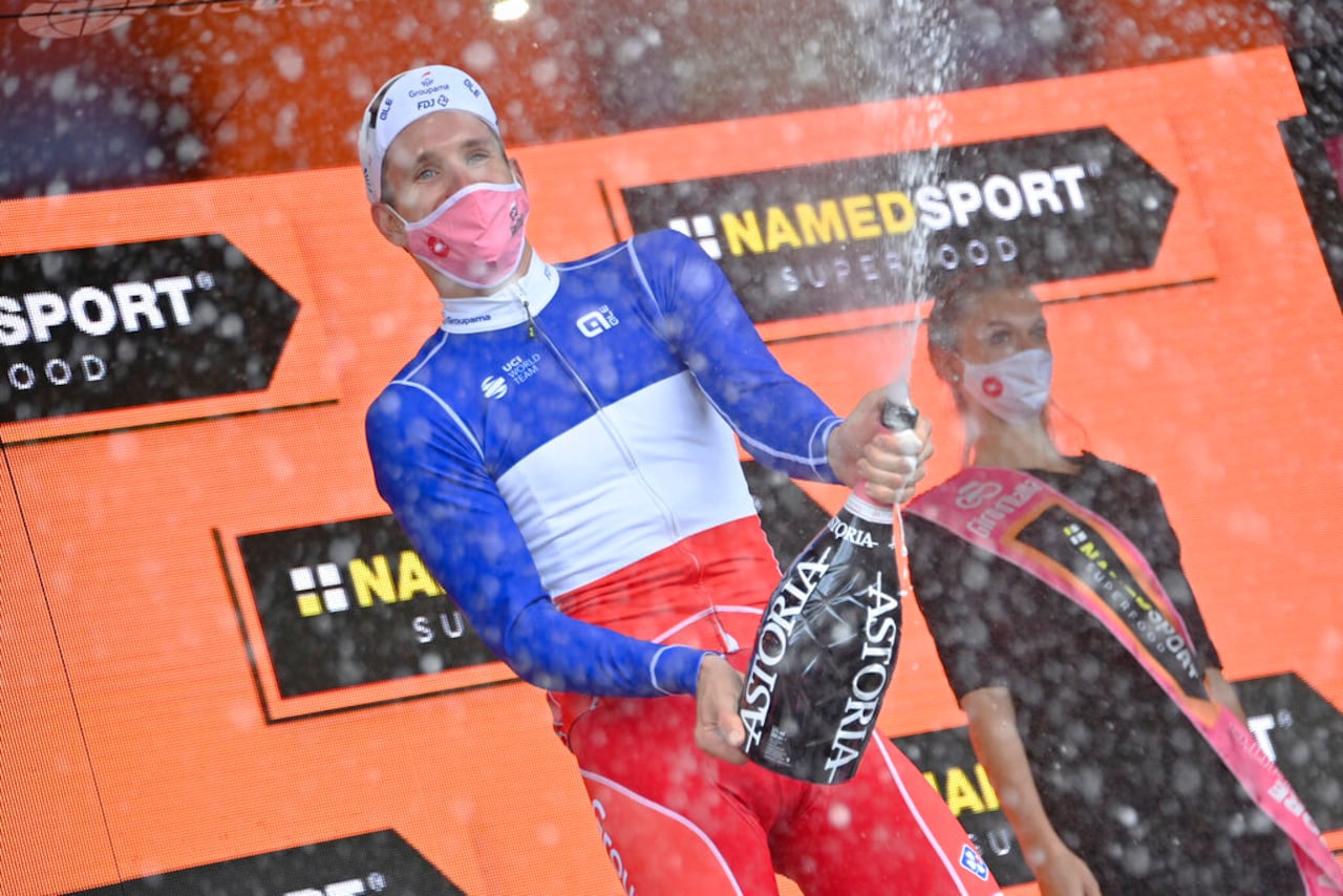 France's Arnaud Demare celebrates on the podium after winning the fourth stage of the Giro d'Italia, tour of Italy cycling race from Catania to Villafranca Tirrena, Sicily, Tuesday, Oct. 6, 2020. (Gian Mattia D'Alberto/LaPresse via AP)