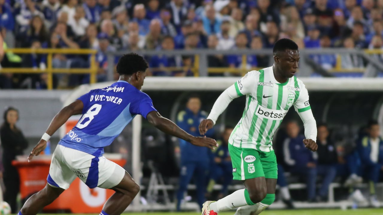 Marino Hinestroza of Atletico Nacional and Dewar Victoria of Millonarios F.C. fight for the ball during the match between Millonarios F.C. and Atletico Nacional on Matchday 13 of the BetPlay DIMAYOR I 2025 League, played at the Nemesio Camacho El Campin Stadium in Bogota, Colombia. (Photo by Daniel Garzon Herazo/NurPhoto via Getty Images)