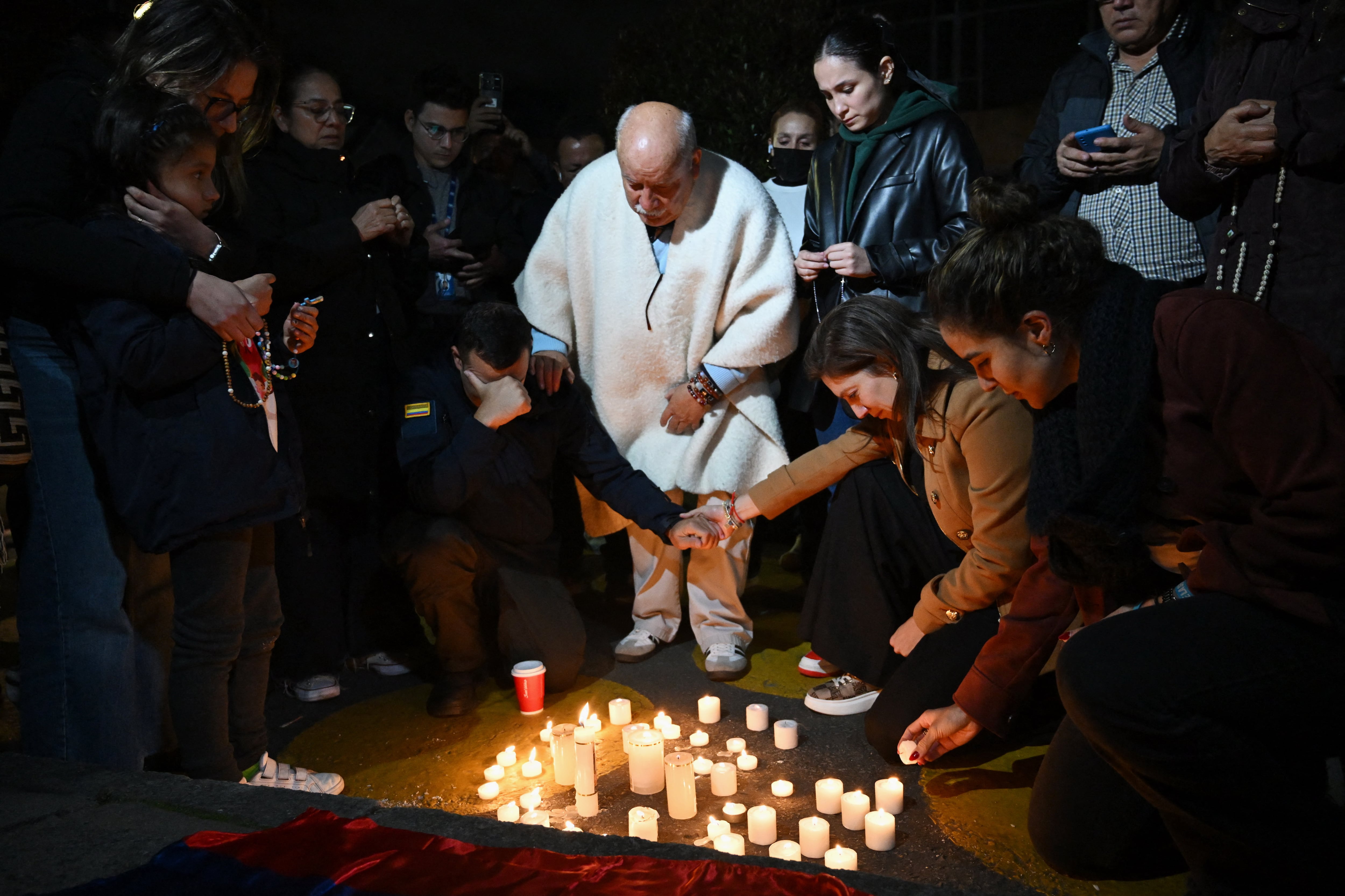 Forensic experts work at the crime scene where Senator Miguel Uribe was shot and wounded in the Modelia neighborhood in Bogota on June 7, 2025. A Colombian right-wing opposition senator and candidate for next year's presidential election, Miguel Uribe, 39, was shot and wounded in Bogota on June 7, 2025, various media reported, while the government denounced an "attack." (Photo by RAUL ARBOLEDA / AFP)