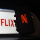 (FILES) In this file ilustration photo taken on March 31, 2020 a computer and a mobile phone screen display the Netflix logo in Arlington, Virginia. - Netflix on March 3, 2021 added a "Fast Laughs" feature to its iPhone app, serving up comic clips in rapid fire, in a move taking on the popular video app TikTok. (Photo by Olivier DOULIERY / AFP)