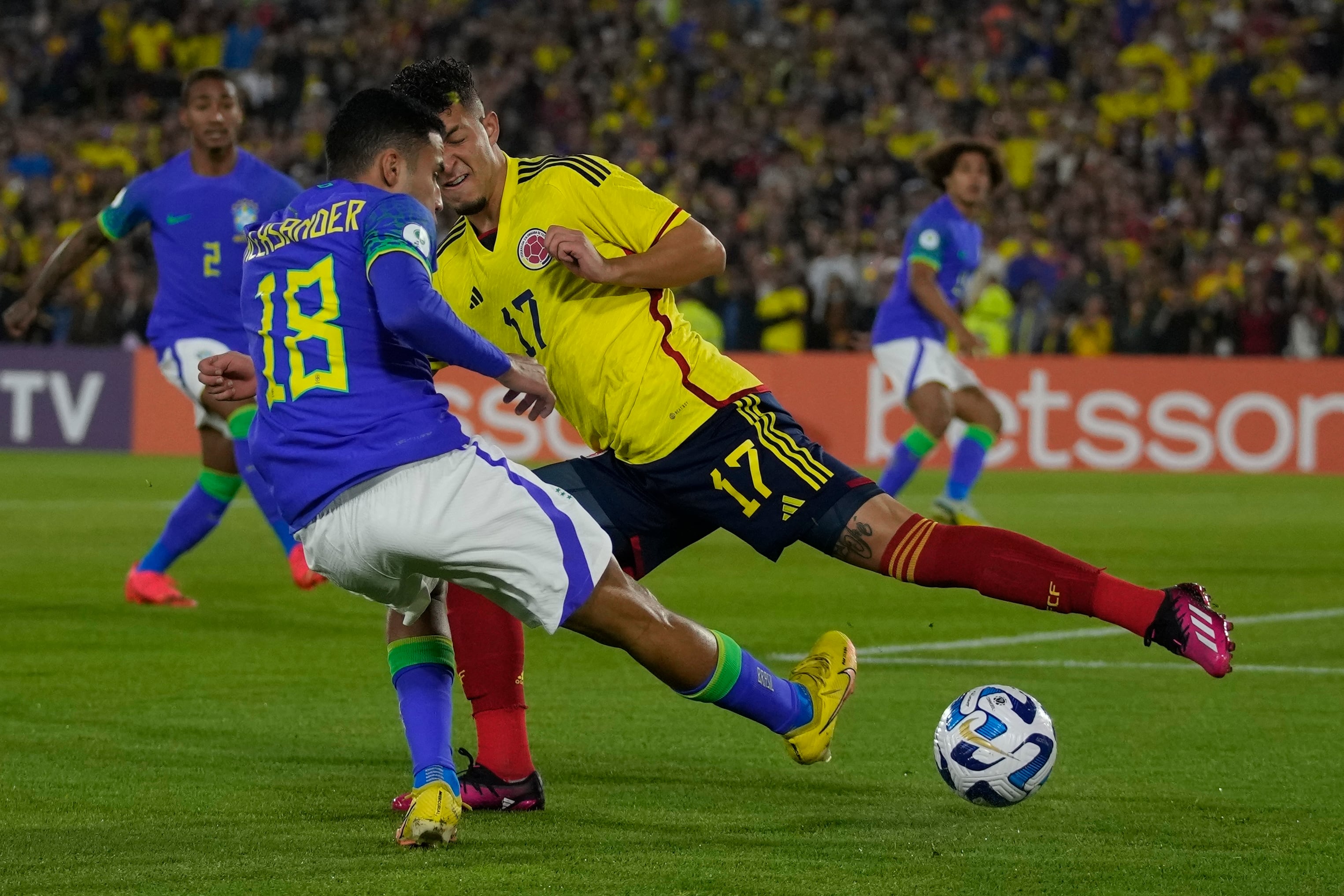 Ecuador's Alan Minda, left, and Uruguay's Facundo Gonzalez go for a header during a South America U-20 soccer match in Bogota, Colombia, Friday, Feb. 3, 2023. (AP Photo/Fernando Vergara)