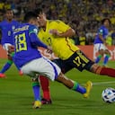 Brazil's Alexsander, left, and Colombia's Andres Salazar fight for the ball during a South America U-20 Championship soccer match in Bogota, Colombia, Thursday, Feb. 9, 2023. (AP Photo/Fernando Vergara)