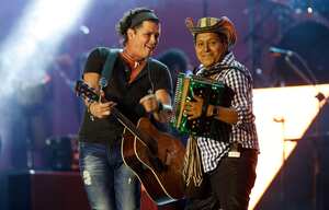 Colombian singer Carlos Vives and accordionist Egidio Cuadrado perform during his "Corazon Profundo" tour at the Ruminahui coliseum in Quito, Ecuador, Friday, Sept. 13, 2013. (AP Photo/Dolores Ochoa)