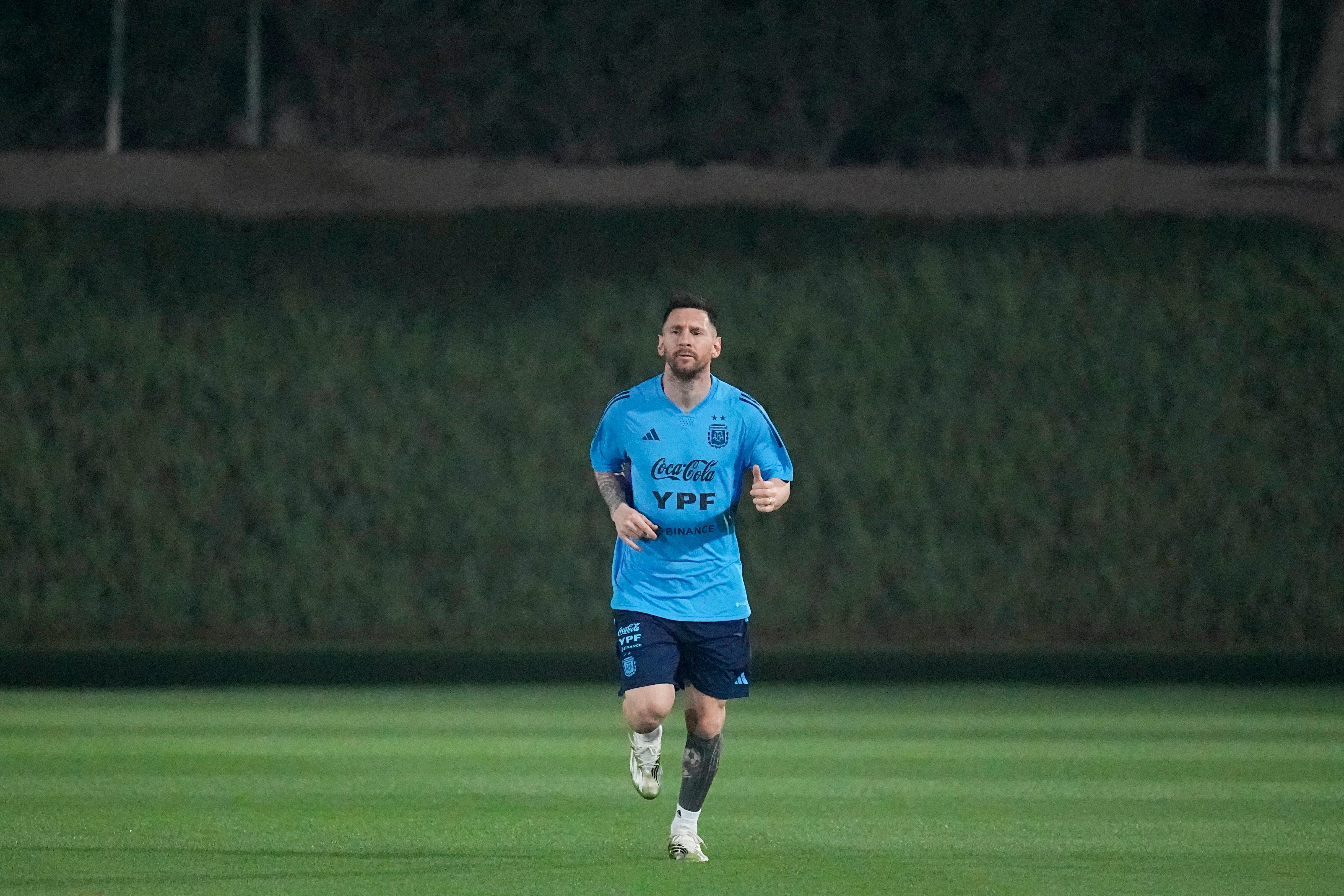 Lionés Messi jogs during a training session of Argentina's national soccer team in Doha, Saturday, Nov. 19, 2022. (AP Photo/Jorge Saenz)