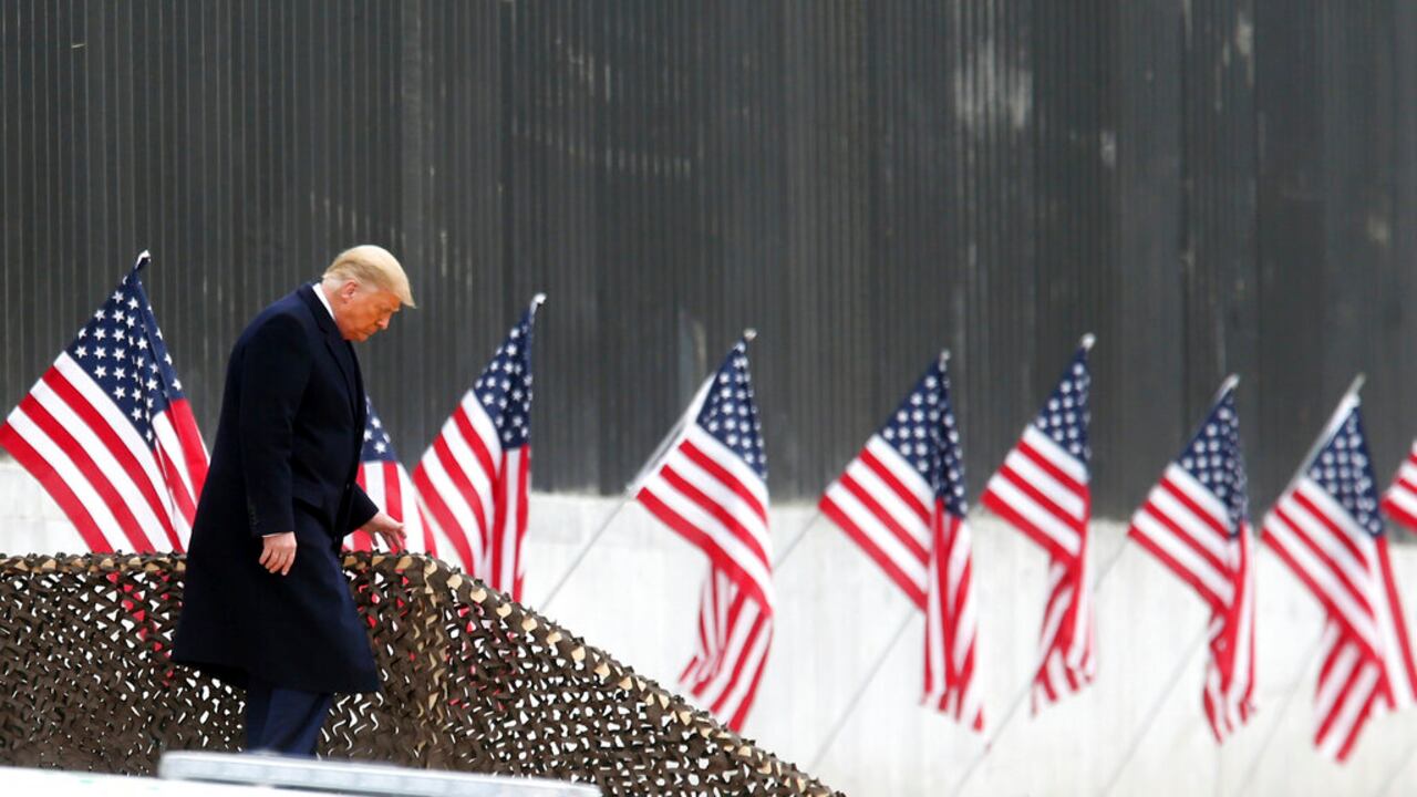 President Donald Trump walks down the steps before a speech near a section of the U.S.-Mexico border wall, Tuesday, Jan. 12, 2021, in Alamo, Texas. (Delcia Lopez/The Monitor via AP)