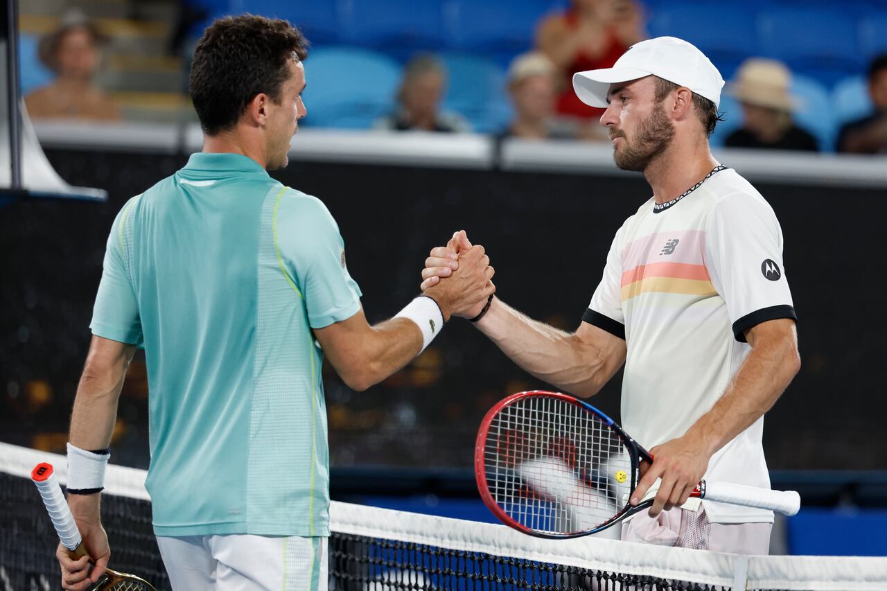Tommy Paul, right, of the U.S. is congratulated by Roberto Bautista Agut of Spain following their fourth round match at the Australian Open tennis championship in Melbourne, Australia, Monday, Jan. 23, 2023. (AP Photo/Asanka Brendon Ratnayake)
