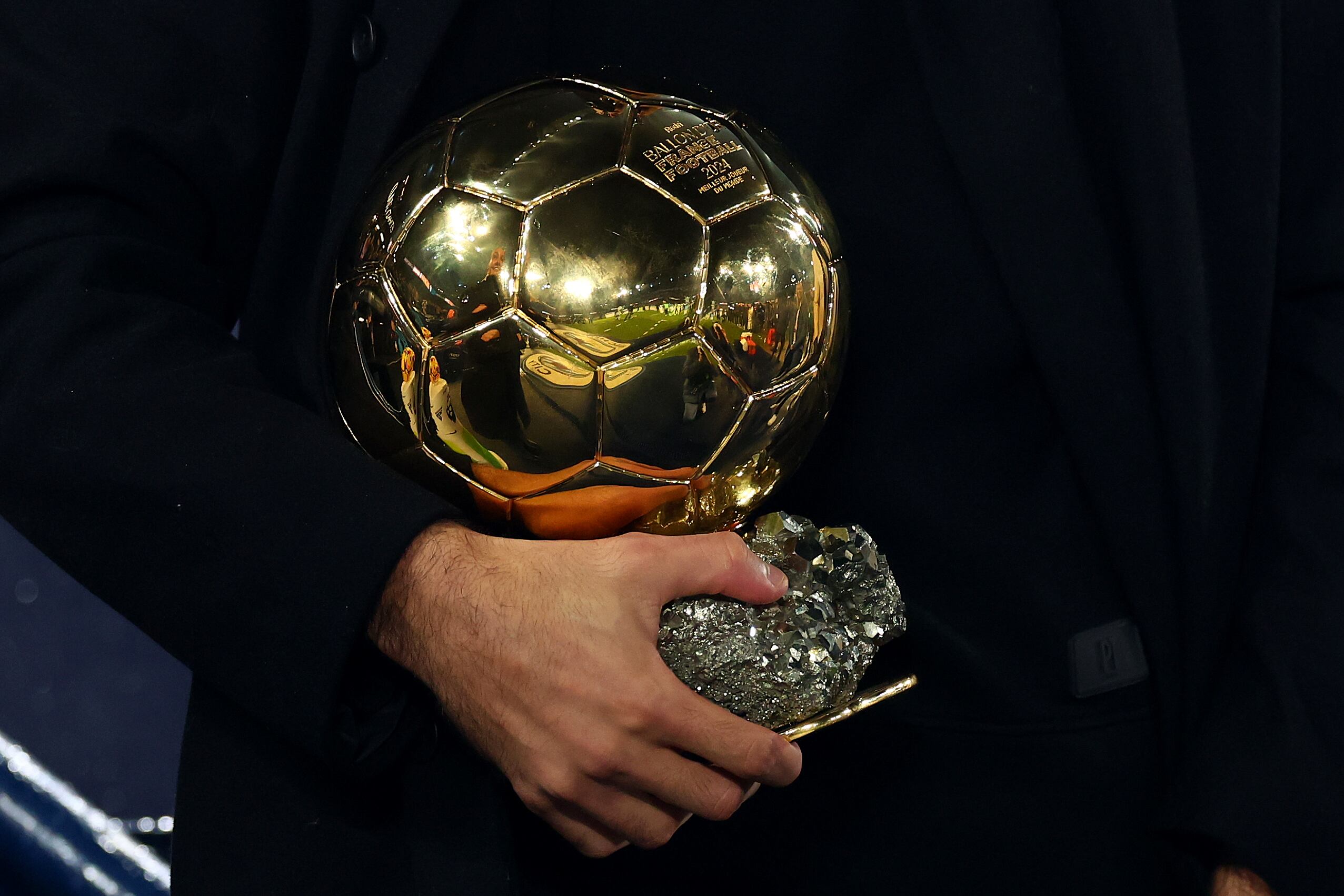 MANCHESTER, ENGLAND - NOVEMBER 23: Rodri of Manchester City holds the 2024 Ballon d'or trophy during the Premier League match between Manchester City FC and Tottenham Hotspur FC at Etihad Stadium on November 23, 2024 in Manchester, England. (Photo by Shaun Brooks - CameraSport via Getty Images)
