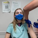 Audrey Vakker, 14, looks on as she get a Covid-19 vaccination at the Fairfax Government Center vaccination clinic in Fairfax, Virginia on May 13, 2021. - The campaign to immunize America's 17 million adolescents aged 12-to-15 kicked off in full force on May 13, a key part of President Joe Biden's strategy to push the country close to herd immunity. (Photo by ANDREW CABALLERO-REYNOLDS / AFP)