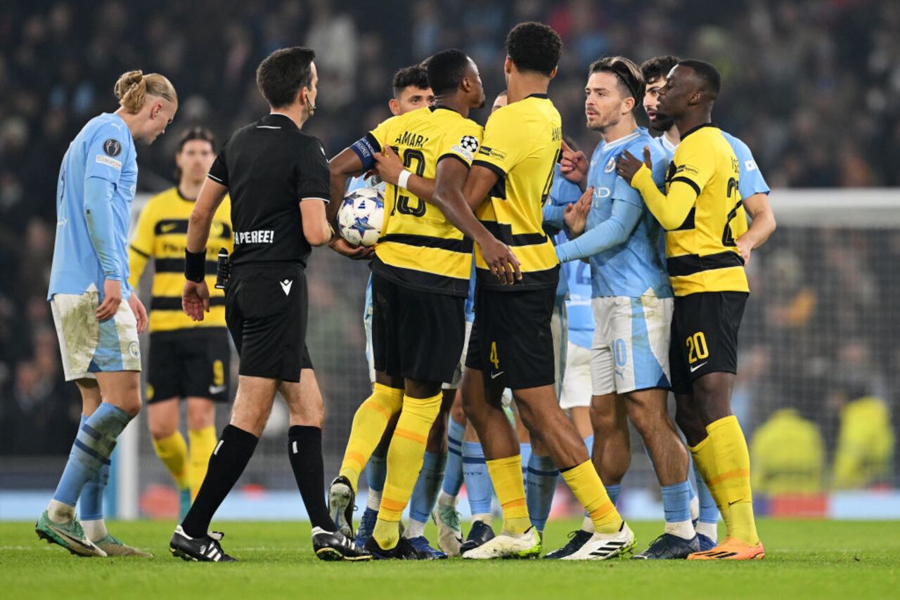 MANCHESTER, ENGLAND - NOVEMBER 07: Mohamed Ali Camara of Young Boys and Jack Grealish of Manchester City clash during the UEFA Champions League match between Manchester City and BSC Young Boys at Etihad Stadium on November 07, 2023 in Manchester, England. (Photo by Michael Regan/Getty Images)
