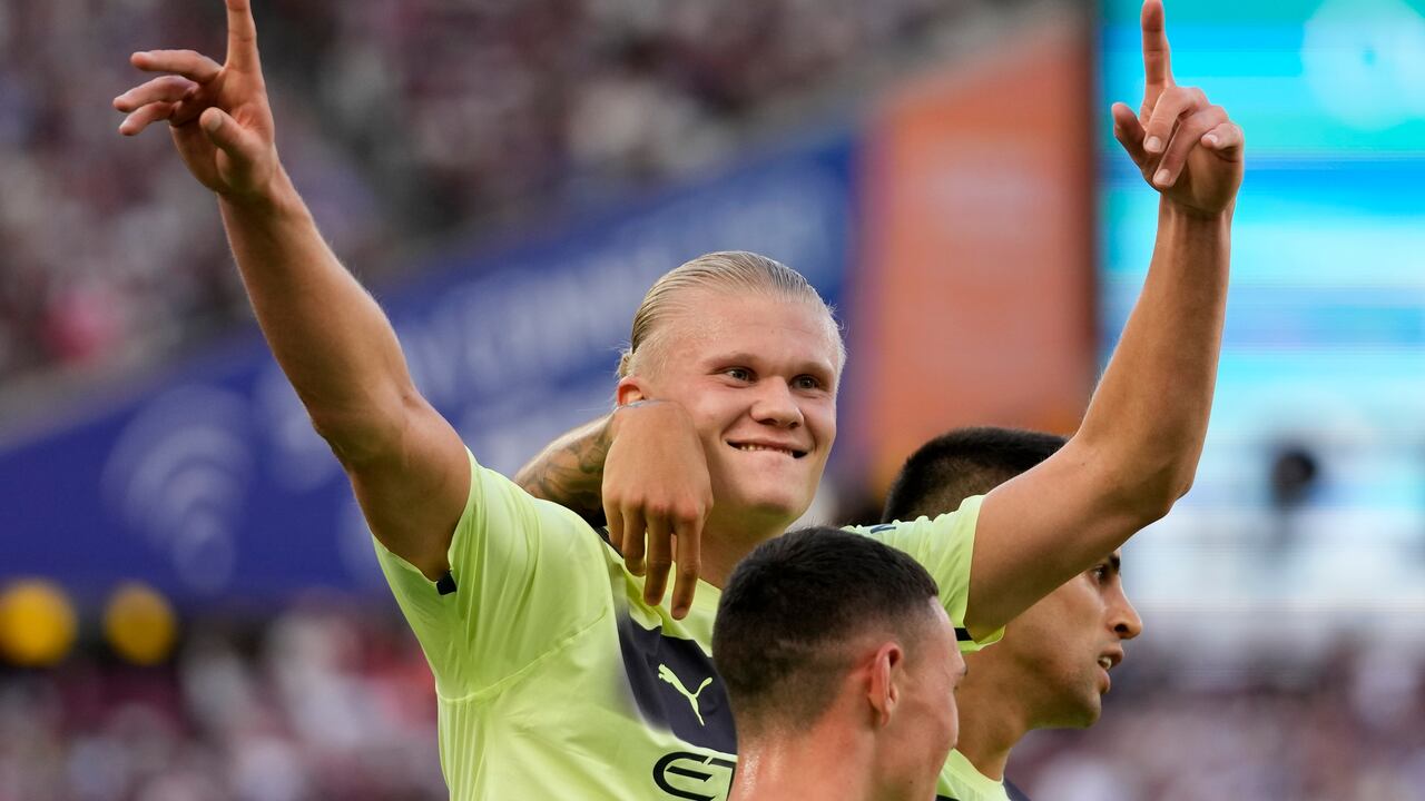 Manchester City's Erling Haaland celebrates after scoring his sides second goal during the English Premier League soccer match between West Ham United and Manchester City at the London Stadium in London, England, Sunday, Aug. 7, 2022. (AP Photo/Frank Augstein)