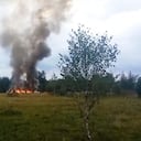 In this image taken from video, smoke and flames rise from a crashed private jet near the village of Kuzhenkino, Tver region, Russia, Wednesday, Aug. 23, 2023. Russian mercenary leader Yevgeny V. Prigozhin, the founder of the Wagner Group, reportedly died when a private jet he was said to be on crashed on Aug. 23, 2023, killing all 10 people on board. (AP Photo)