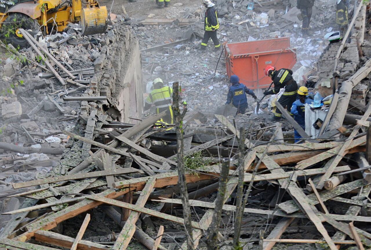 KYIV, UKRAINE - APRIL 24: Rescue workers respond at the site of a Russian missile strike on apartment residential buildings in Svyatoshynskyi district on April 24, 2025 in Kyiv, Ukraine. In the early morning, Russia has launched a mass combined attack on the Ukrainian capital, and other cities of Ukraine. The strike on Kyiv resulted in the destruction of multi-story residential buildings, damage to administrative buildings, and non-residential buildings. At least ten people were killed and 63 were injured, including six children. Rescue workers continue to search for people under the rubble. (Photo by Oleksandr Gusev/Global Images Ukraine via Getty Images)