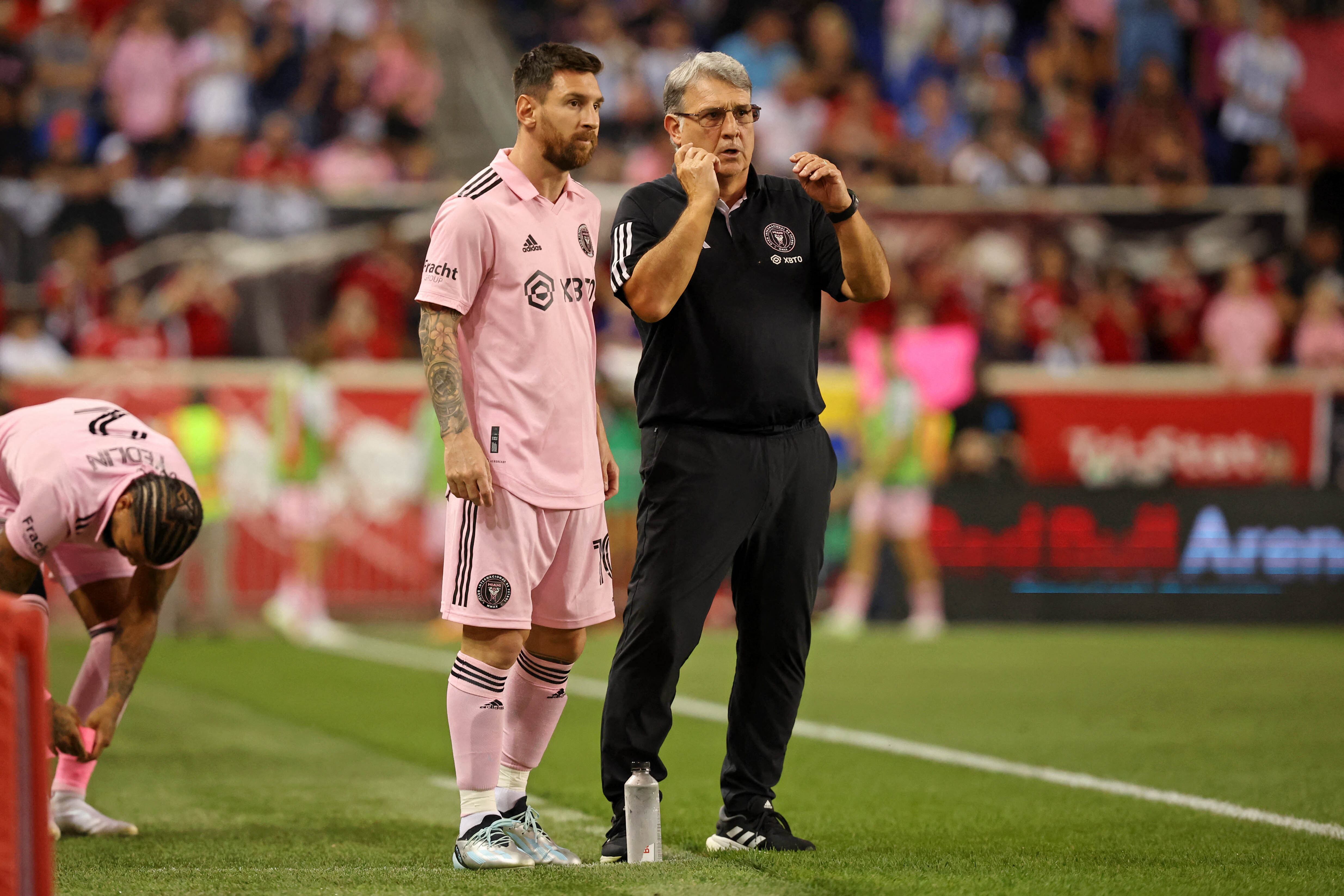 Aug 26, 2023; Harrison, New Jersey, USA; Inter Miami CF forward Lionel Messi (10) talks with head coach Gerardo Martino before being put into the game New York Red Bulls during the second half at Red Bull Arena. Mandatory Credit: Vincent Carchietta-USA TODAY Sports