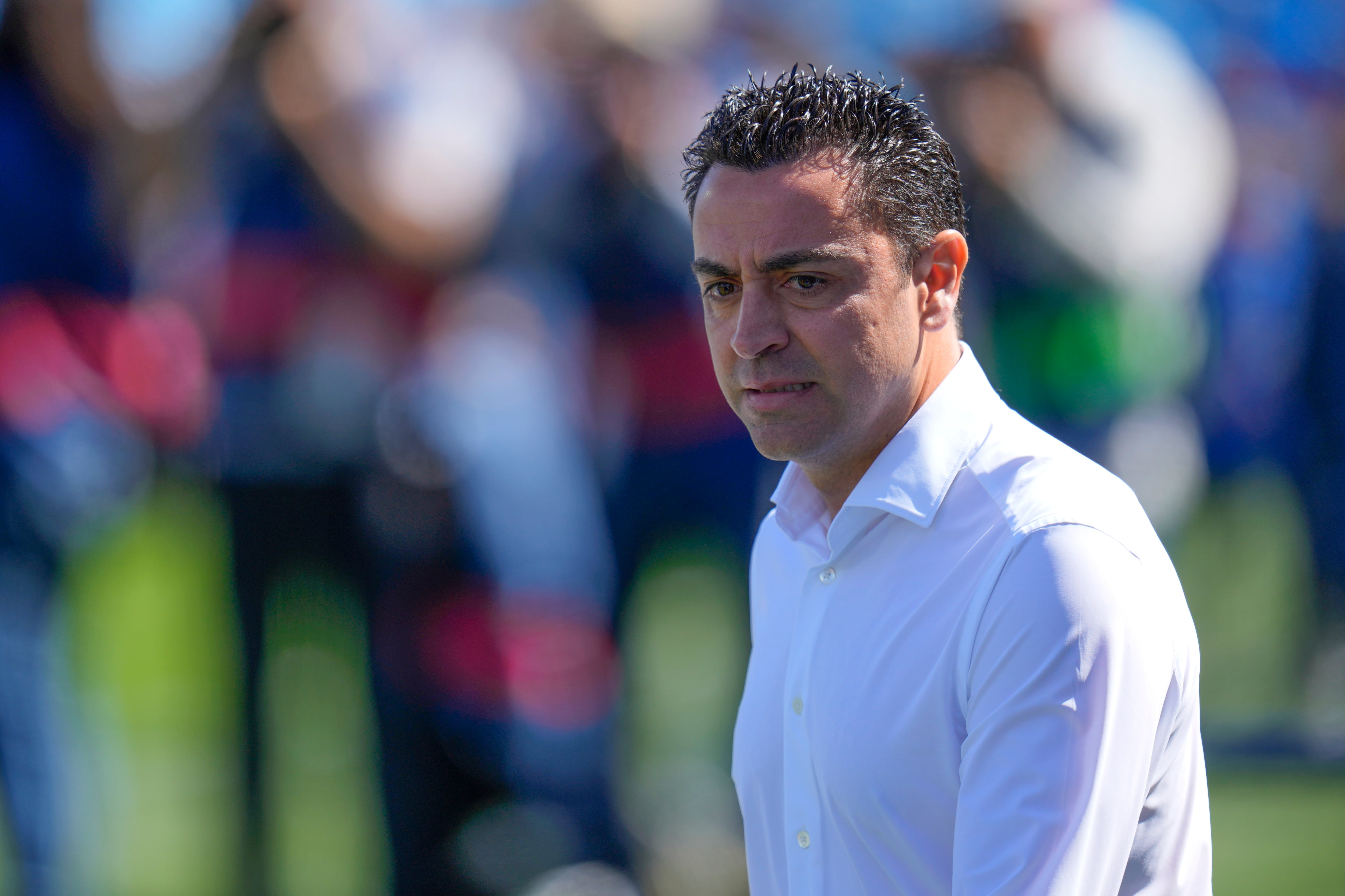 Barcelona's head coach Xavi Hernandez attends the Spanish La Liga soccer match between Getafe and FC Barcelona at the Coliseum Alfonso Perez stadium in Getafe, Spain, Sunday, April 16, 2023. (AP Photo/Manu Fernandez)