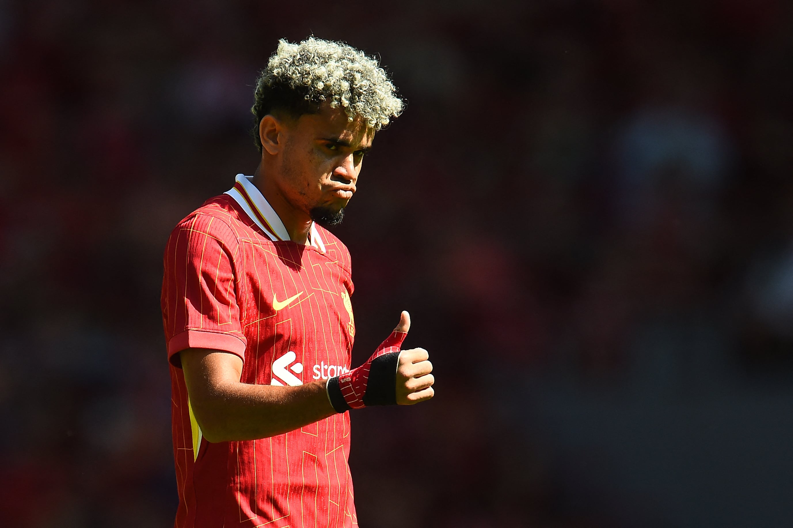 Liverpool's Colombian midfielder #07 Luis Diaz reacts during the pre-season friendly football match between Liverpool and Sevilla at Anfield stadium in Liverpool, northwest England on August 11, 2024. (Photo by Peter POWELL / AFP)
