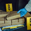 Packages of narcotics in car trunk. Drug smuggling.