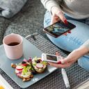 Mid adult diabetic woman having breakfast at home during pandemic crisis.
