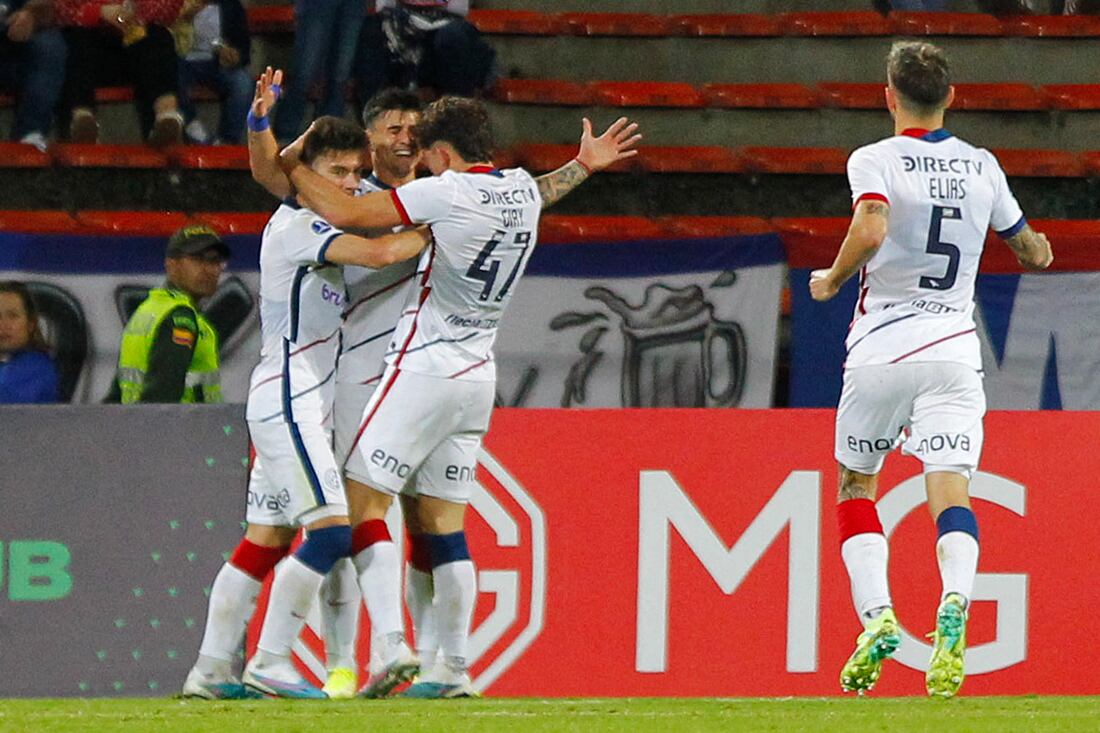 San Lorenzo's Paraguayan forward Adam Bareiro (2-L) celebrates after scoring during the Copa Sudamericana round of 32 knockout play-offs first leg football match between Colombia's Independiente Medellin and Argentina's San Lorenzo at the Atanasio Girardot stadium in Medellin, Colombia, on July 12, 2023. (Photo by Freddy BUILES / AFP)