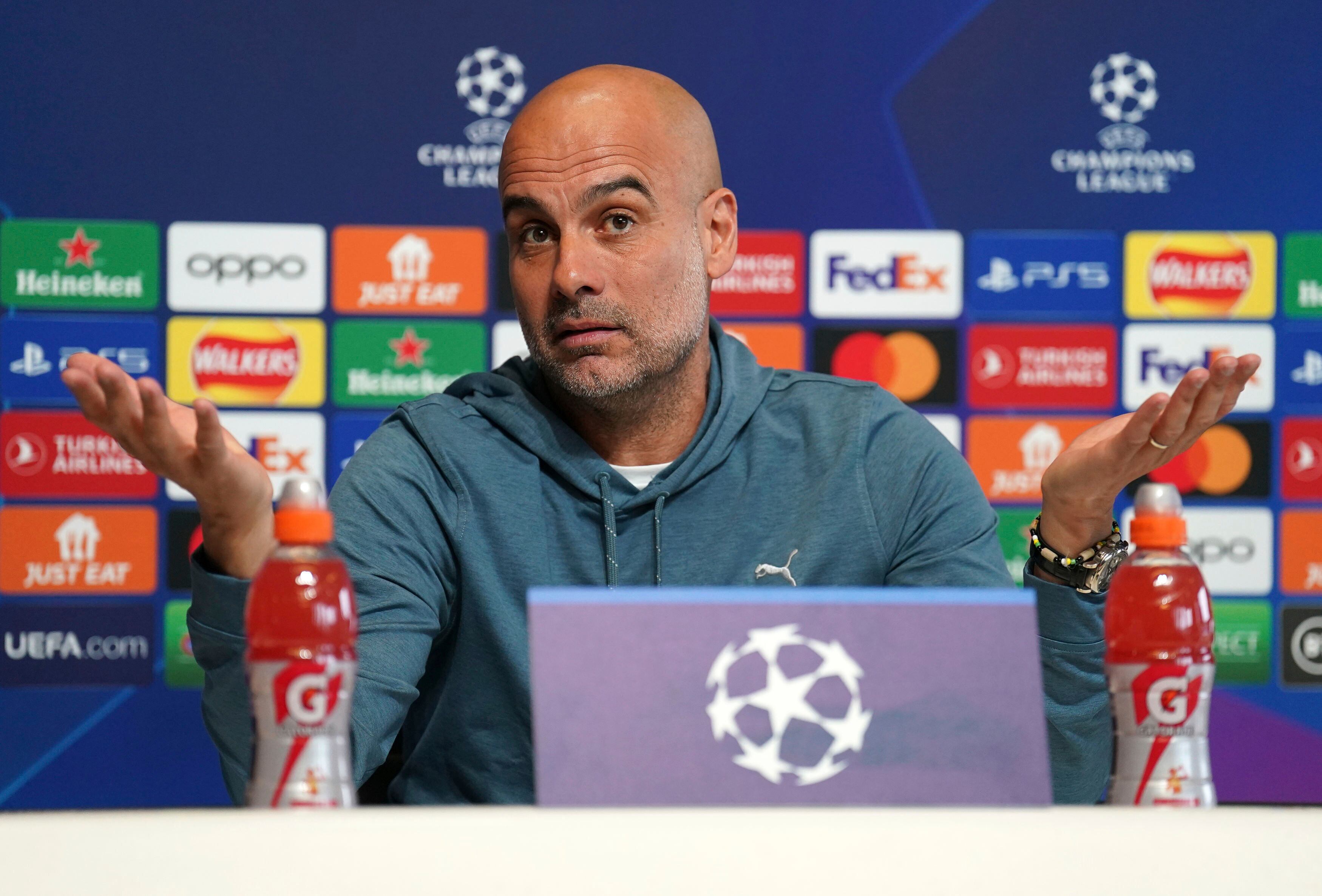 Manchester City manager Pep Guardiola gestures during a press conference at the City Football Academy, Manchester, Britain, ahead of their Champions League quarterfinal soccer match with Bayern Munich, Monday, April 10, 2023. (Mike Egerton/PA via AP)