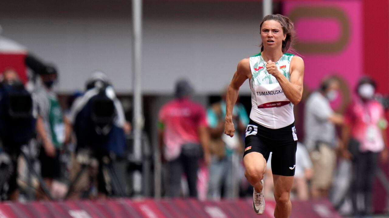 Krystsina Tsimanouskaya, of Belarus, runs in the women's 100-meter run at the 2020 Summer Olympics, Friday, July 30, 2021. Tsimanouskaya alleged her Olympic team tried to remove her from Japan in a dispute that led to a standoff Sunday, Aug. 1, at Tokyo’s main airport. An activist group supporting Tsimanouskaya said she believed her life was in danger in Belarus and would seek asylum with the Austrian embassy in Tokyo. (AP Photo/Petr David Josek)