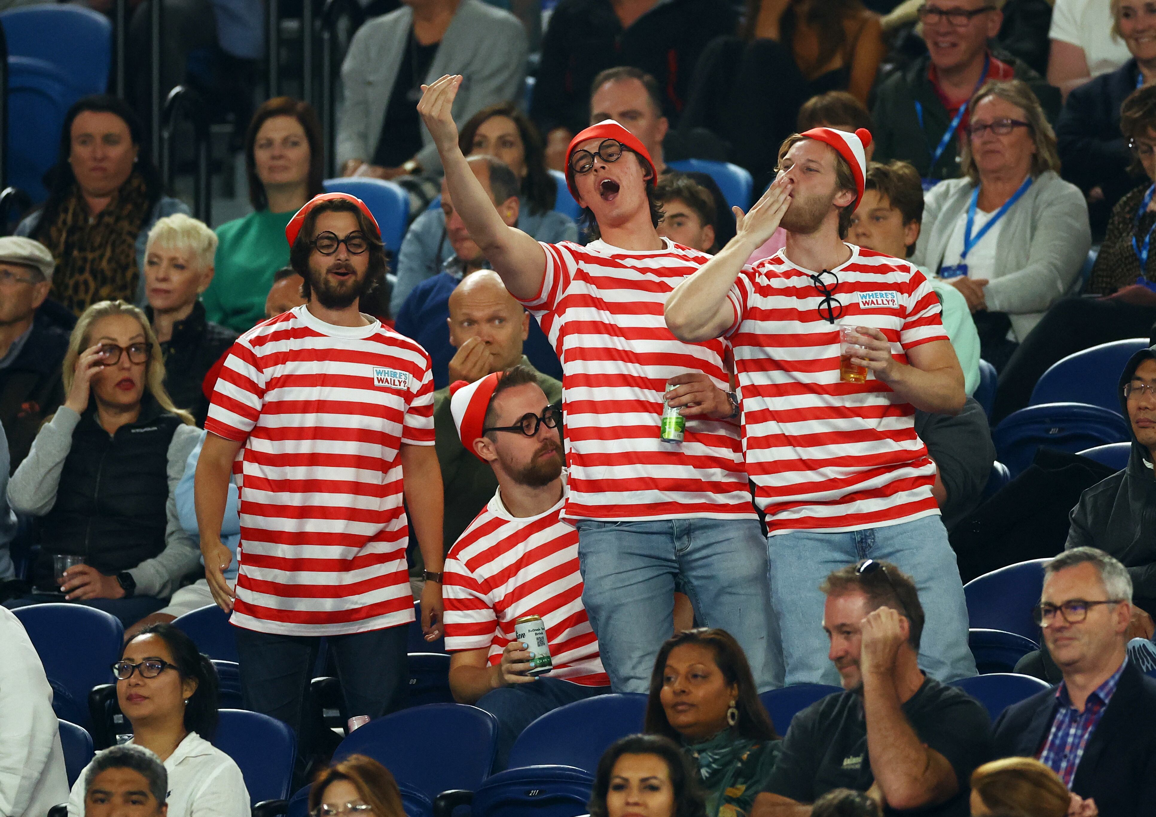 Tennis - Australian Open - Melbourne Park, Melbourne, Australia - January 19, 2023 Spectators are picture in the stands wearing fancy dress during the second round match between Serbia's Novak Djokovic and France's Enzo Couacaud REUTERS/Carl Recine