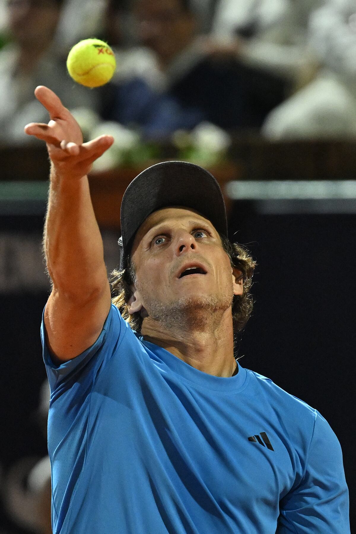 Uruguay's Diego Forlan serves the ball next to Argentina's Federico Coria (out of frame) as they play against Bolivia's Boris Arias and Fernando Zeballos during their men's doubles match of the Uruguay Open Challenger ATP tournament at the Carrasco Lawn Tennis Club in Montevideo on November 13, 2024. (Photo by Eitan ABRAMOVICH / AFP)