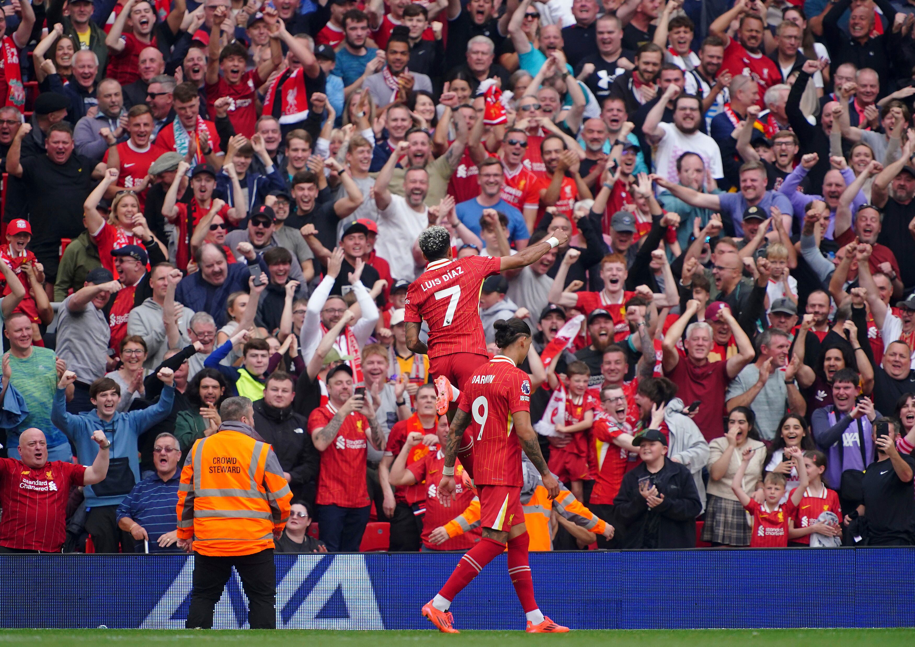 Liverpool's Luis Diaz celebrates scoring his side's second goal of the game, during the English Premier League soccer match between Liverpool and Bournemouth, at Anfield, in Liverpool, England, Saturday, Sept. 21, 2024. (Peter Byrne/PA via AP)