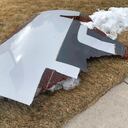 In this photo provided by the Broomfield Police Department on Twitter, debris is scattered across the turf field at Commons Park, Saturday, Feb. 20, 2021, in Broomfield, Colo. The police ask that the area be avoided if possible. A commercial airliner dropped debris in Colorado neighborhoods during an emergency landing Saturday. The Broomfield Police Department said on Twitter that the plane landed safely at Denver International Airport and that no injuries had been reported from the incident. (Broomfield Police Department via AP)