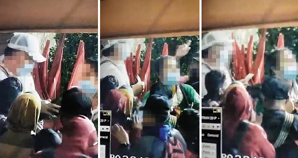 Esta es una imagen del video en el que un hombre le entrega dinero a un grupo de personas antes de salir a las marchas. La grabación es analizada por los investigadores.