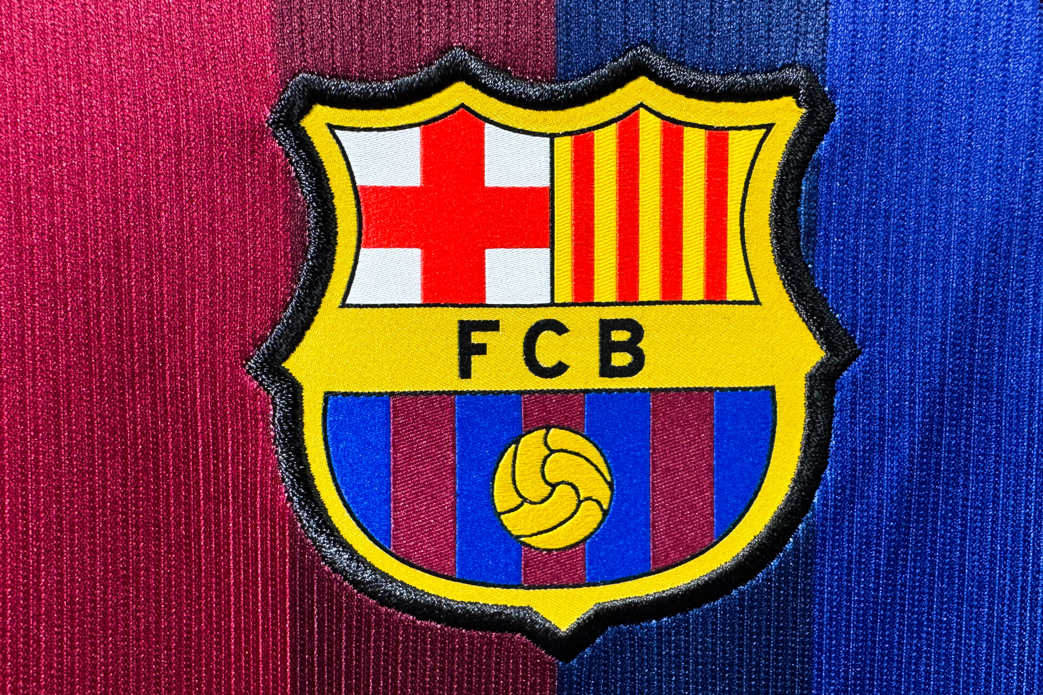 FC Barcelona logo is seen on a jersey at the store in Krakow, Poland on July 13, 2026. (Photo by Jakub Porzycki/NurPhoto via Getty Images)