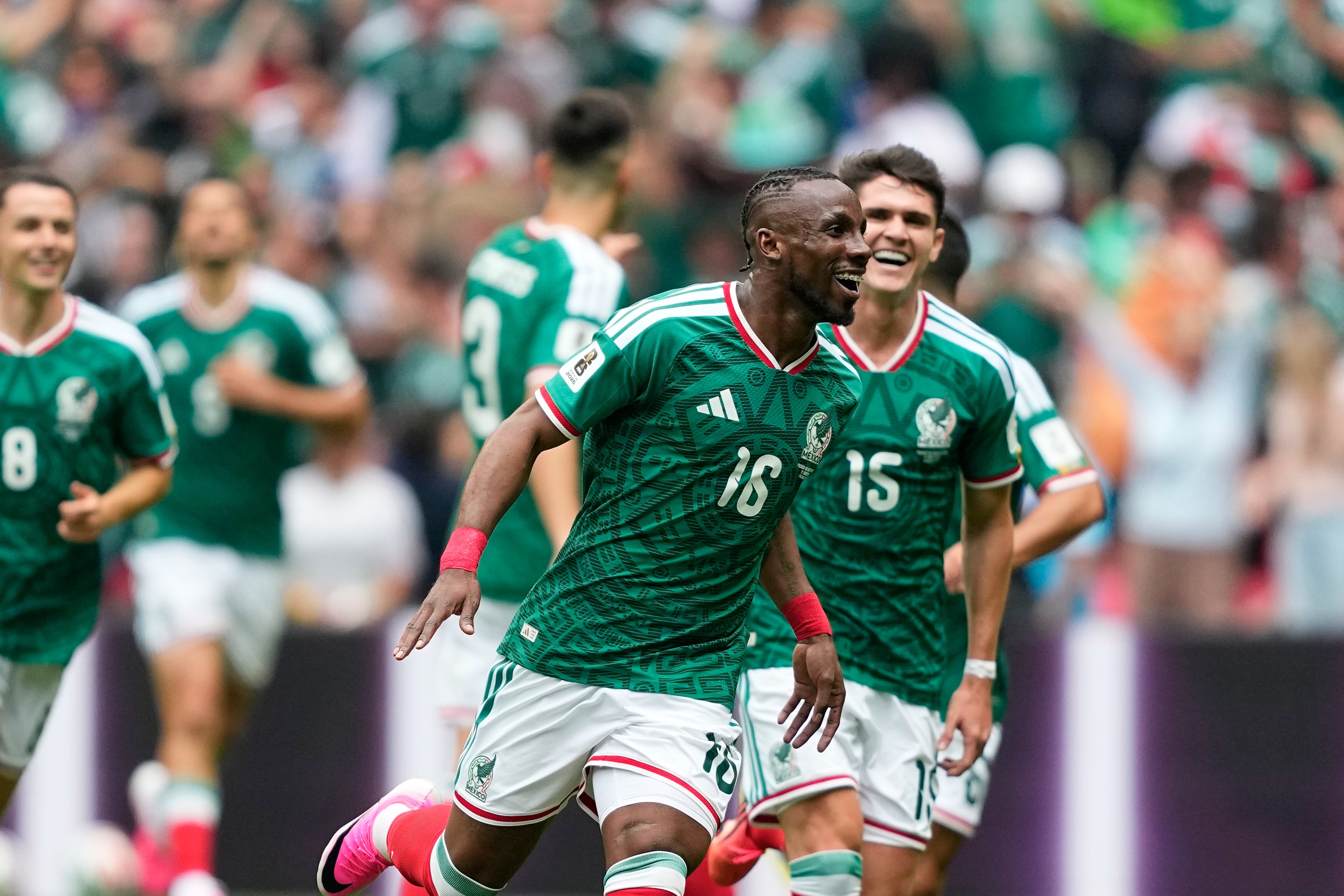Mexico's Julian Quinones, center, celebrates after scoring the opening goal during the World Cup Group A soccer match between Mexico and South Africa in Mexico City, Thursday, June 11, 2026. (AP Photo/Natacha Pisarenko)
