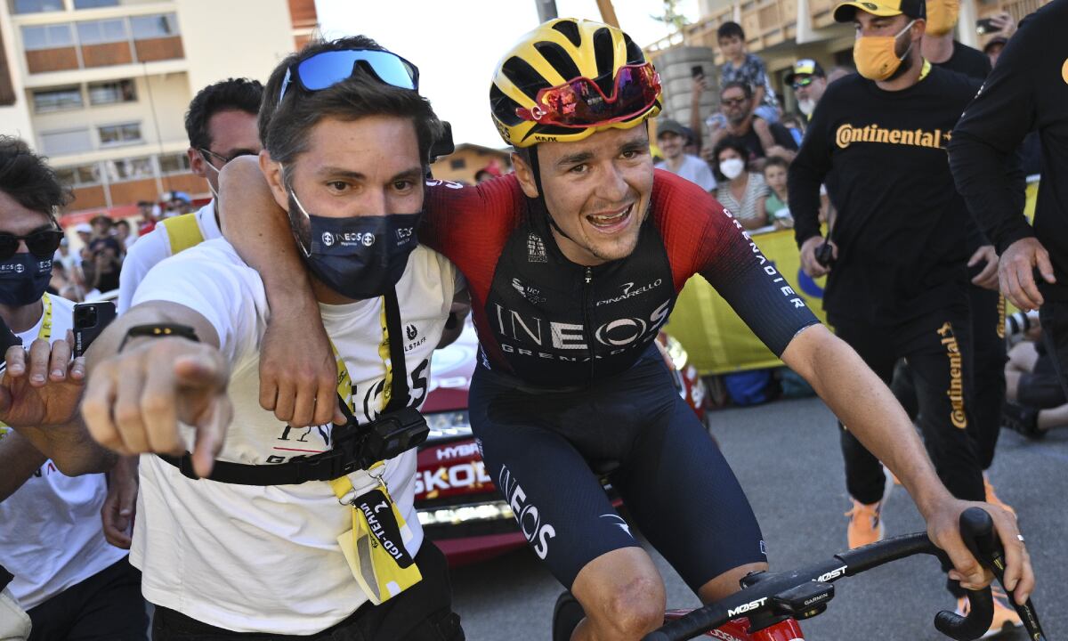 Stage winner Britain's Thomas Pidcock is taken to the podium after the twelfth stage of the Tour de France cycling race over 165.5 kilometers (102.8 miles) with start in Briancon and finish in Alpe d'Huez, France, Thursday, July 14, 2022. (AP/Marco Bertorello/Pool)