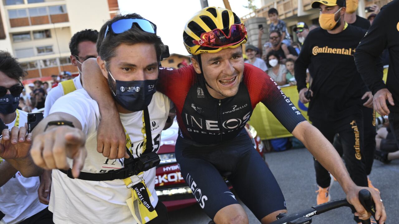 Stage winner Britain's Thomas Pidcock is taken to the podium after the twelfth stage of the Tour de France cycling race over 165.5 kilometers (102.8 miles) with start in Briancon and finish in Alpe d'Huez, France, Thursday, July 14, 2022. (AP/Marco Bertorello/Pool)