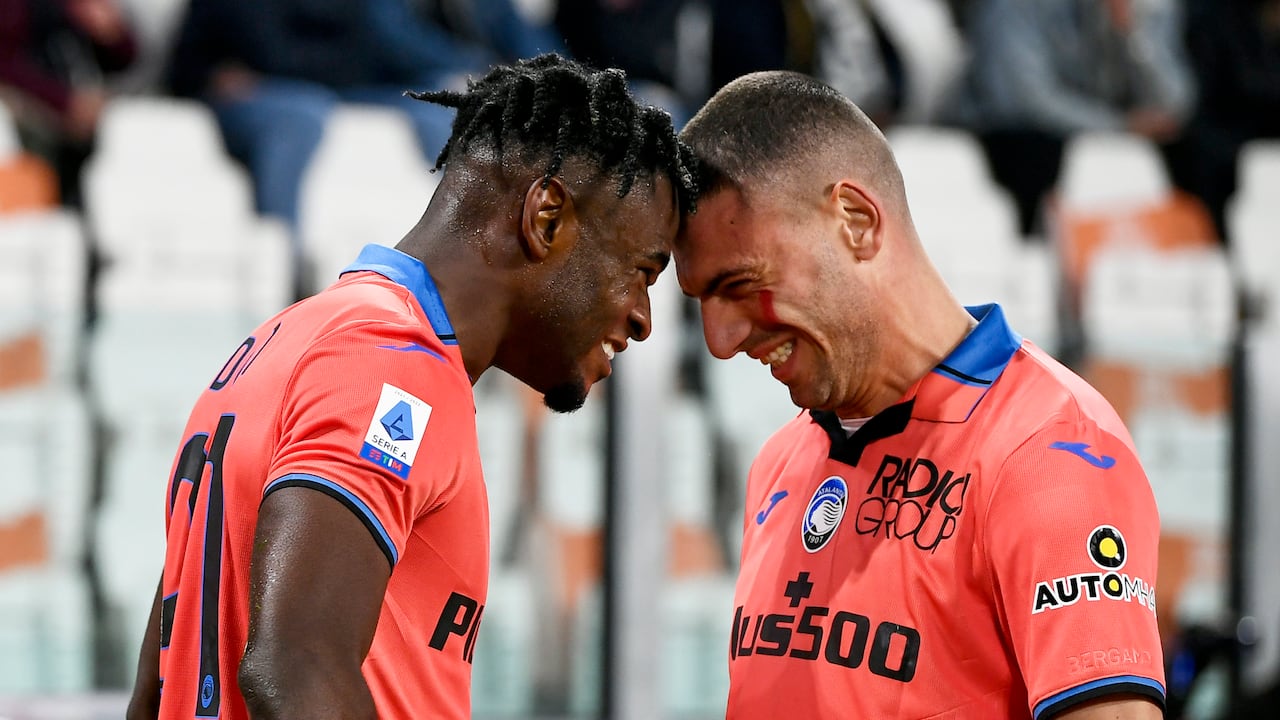 Atalanta's Duvan Zapata, left, celebrates with Merih Demiral after scoring his side's opening goal during the Serie A soccer match between Juventus and Atalanta, at the Allianz stadium in Turin, Italy, Saturday, Nov. 27, 2021. Atalanta won 1-0. (Fabio Ferrari/LaPresse via AP)