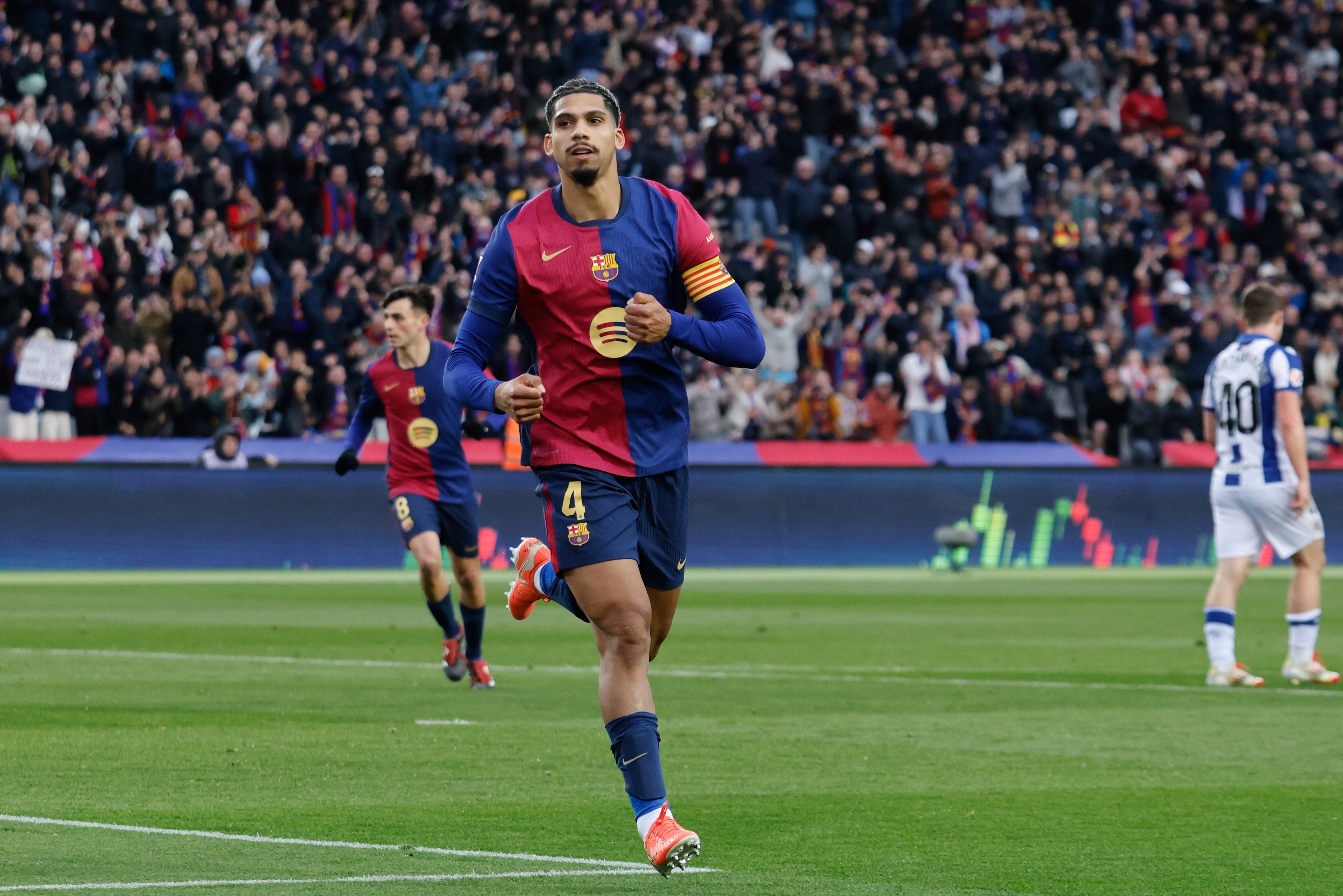 Barcelona's Ronald Araujo celebrates scoring his side's 3rd goal during the Spanish La Liga soccer match between Barcelona and Real Sociedad at the Lluis Companys Olympic Stadium in Barcelona, Spain, Sunday, March 2, 2025. (AP Photo/Joan Monfort)