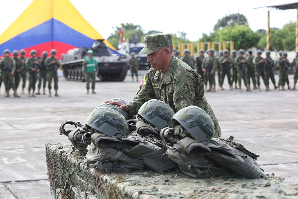 MACHALA , ECUADOR - JANUARY 13: A military member organizes the bulletproof helmet and vests received during an event with armed forces on January 13, 2025 in Machala, Ecuador. (Photo by Romina Duarte/Agencia Press South/Getty Images)