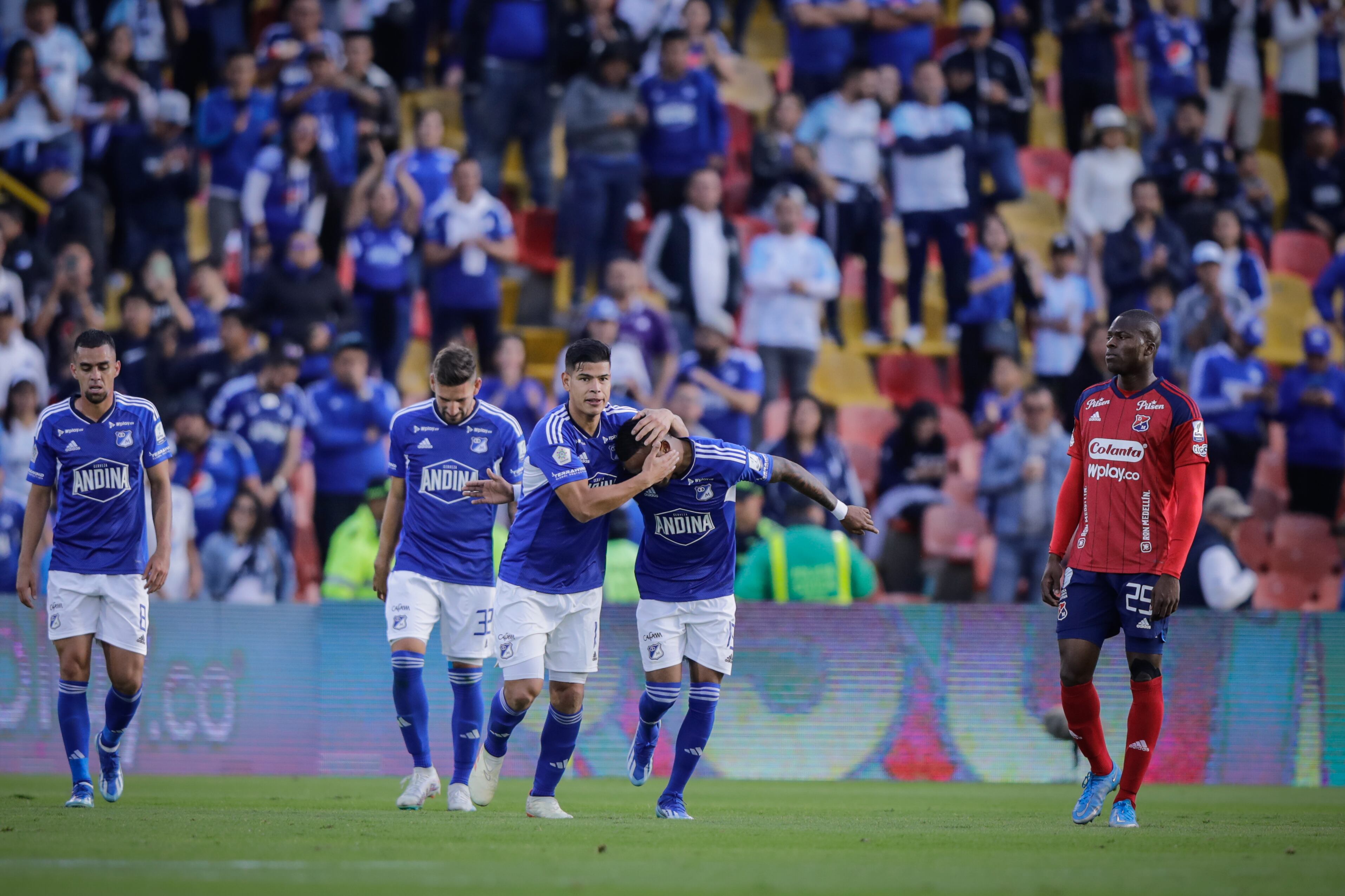 BOGOTA, COLOMBIA - JANUARY 21: Players of Millonarios (L) celebrate the fourth goal during the Liga BetPlay 1st round match between Millonarios and Independiente Medellin at Estadio El Campin on January 21, 2024 in Bogota, Colombia. (Photo by Andres Rot/Getty Images)