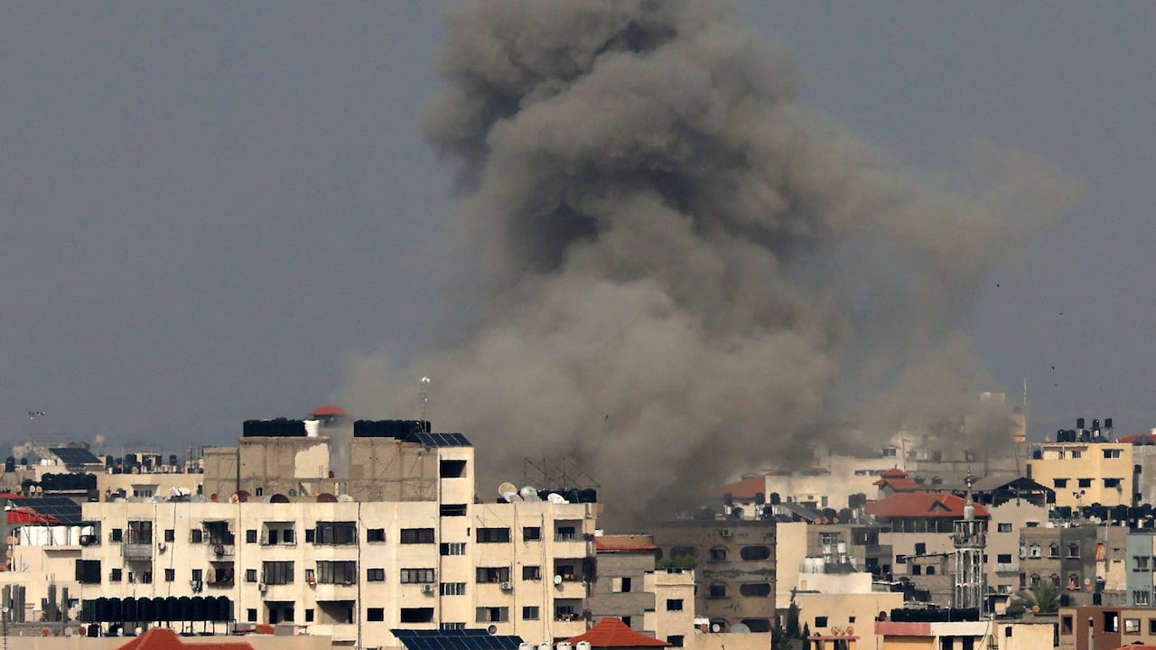 Smoke rises from buildings in Gaza City on May 12, 2023, during an Israeli air strike. Israel and Gaza militants traded heavy fire on May 12, as hopes faded of securing a truce to end days of fighting that have killed dozens, all but one of them Palestinian. (Photo by MAHMUD HAMS / AFP)