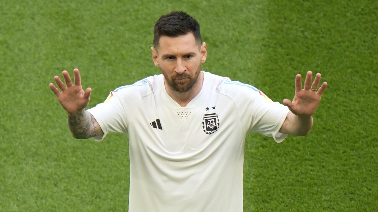 Argentina's Lionel Messi waves to the spectators prior to the start of the World Cup group C soccer match between Argentina and Saudi Arabia at the Lusail Stadium in Lusail, Qatar, Tuesday, Nov. 22, 2022. (AP/Luca Bruno)